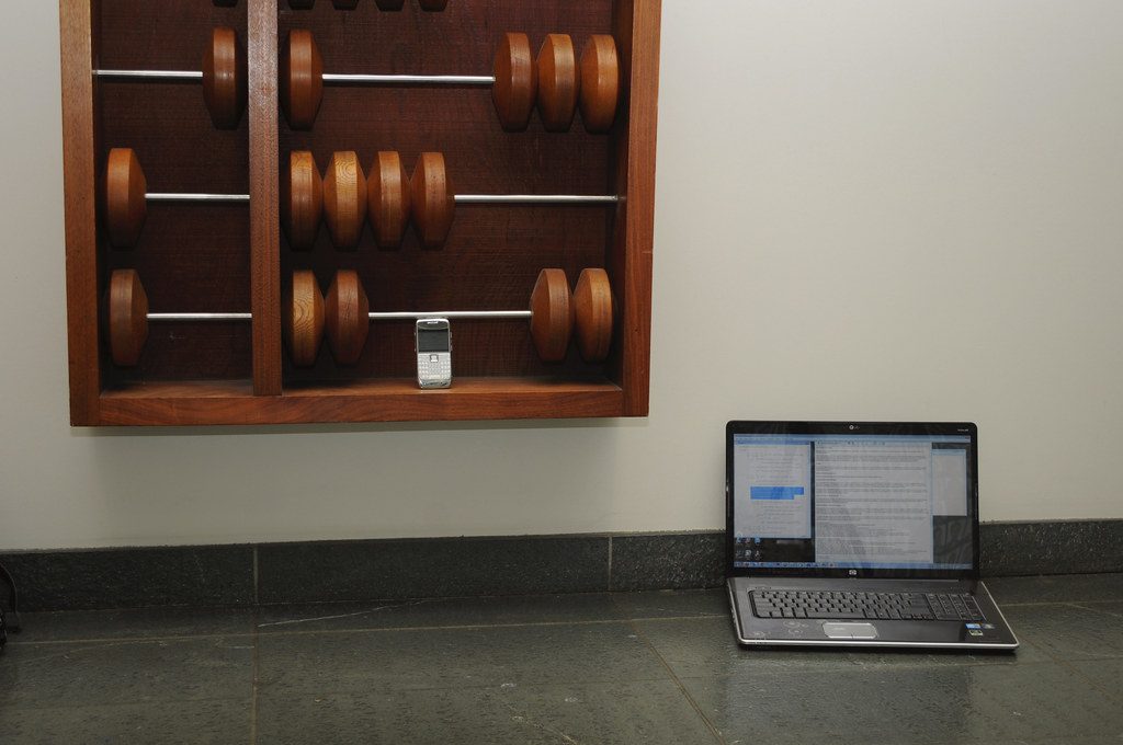 Soda Hall abacus with laptop and smartphone - closeup